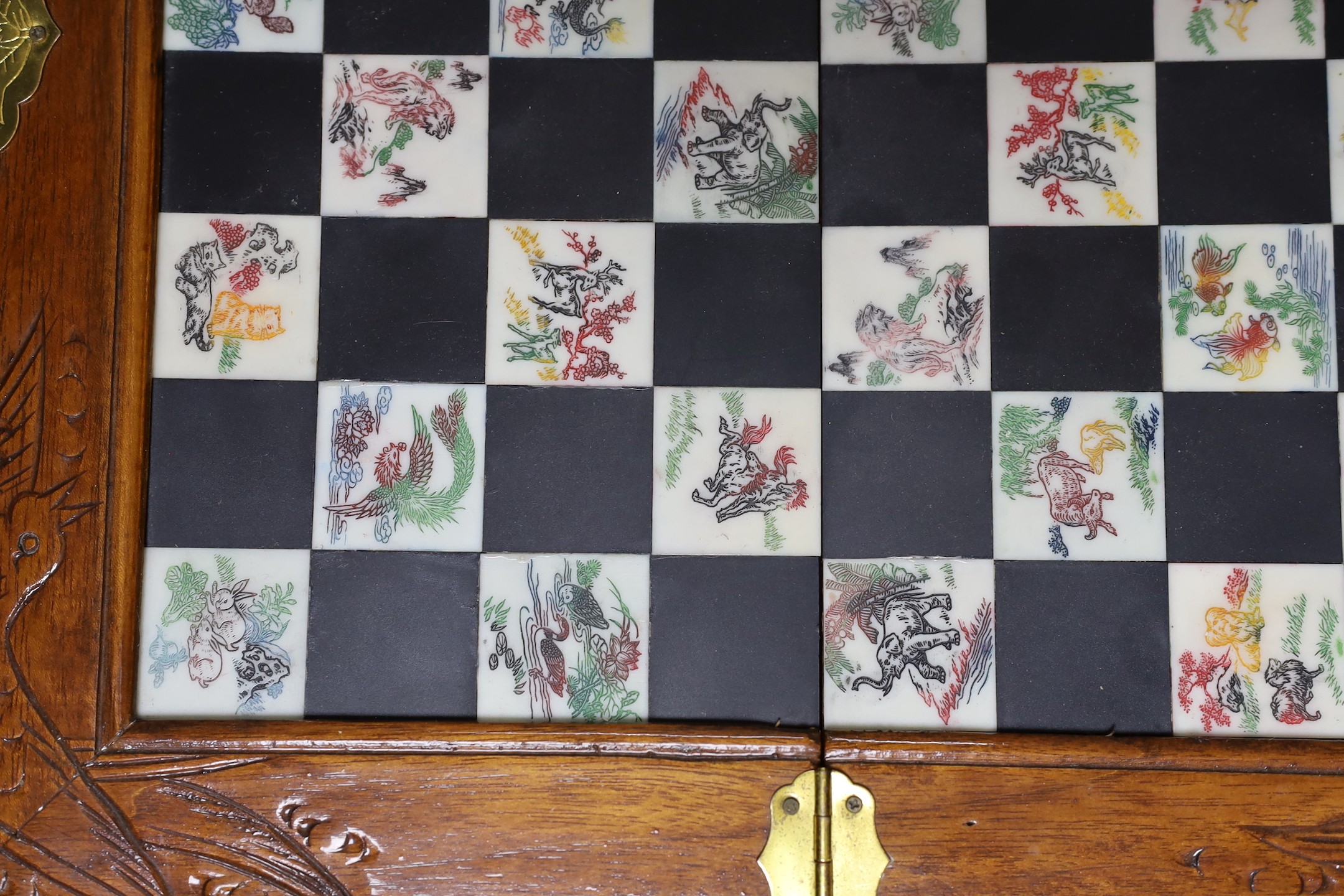 A Chinese chess set with resin pieces, 39x39cm